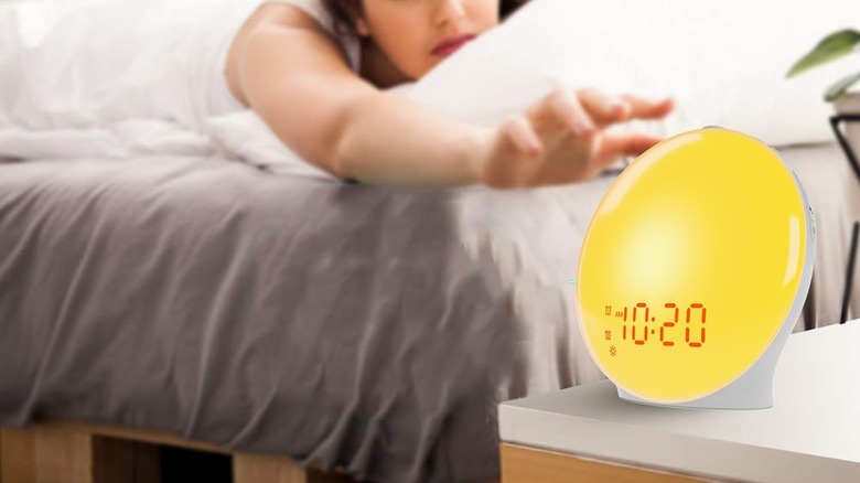 Jall Alarm Clock on the side of someone's bed as they wake up