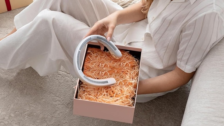 Jisulife Portable Neck Fan being in a gift box and given to someone