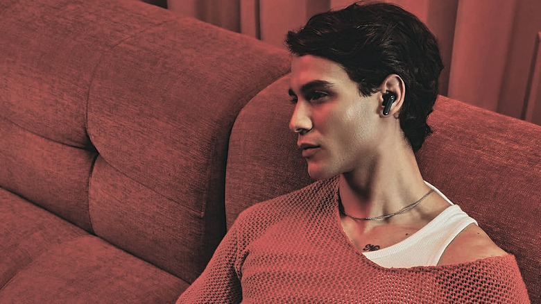 A man wearing the CMF Buds 2