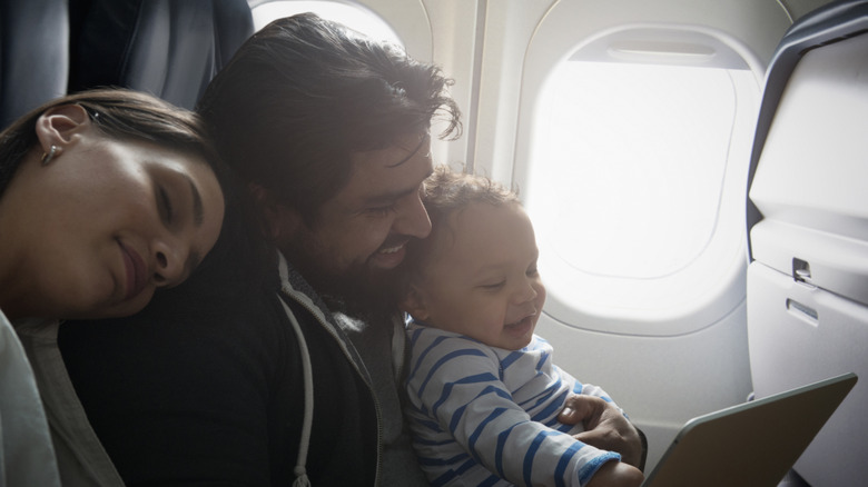 A happy family on an airplane.