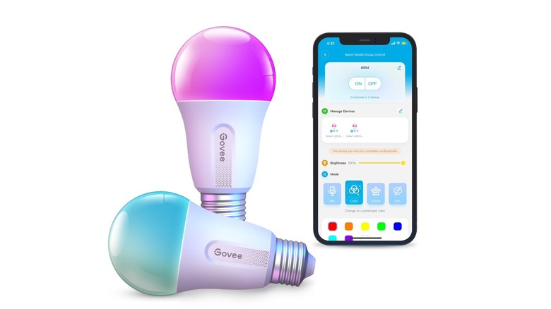 Two Govee RGBWW smart LED bulbs beside its companion app mocked up on a phone against a white background.