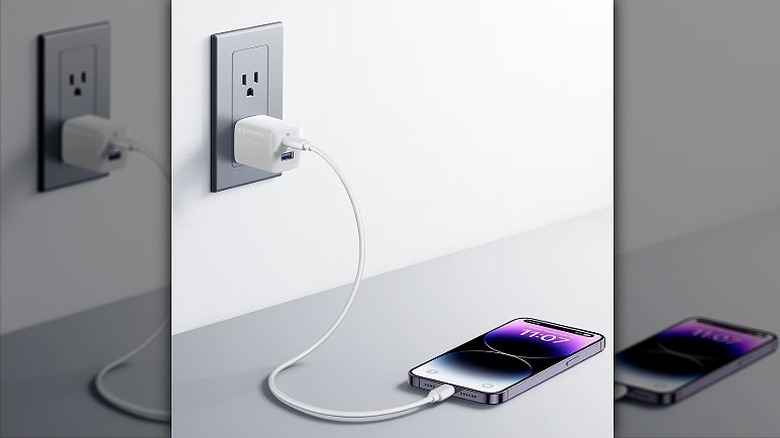 White charger charging an iPhone