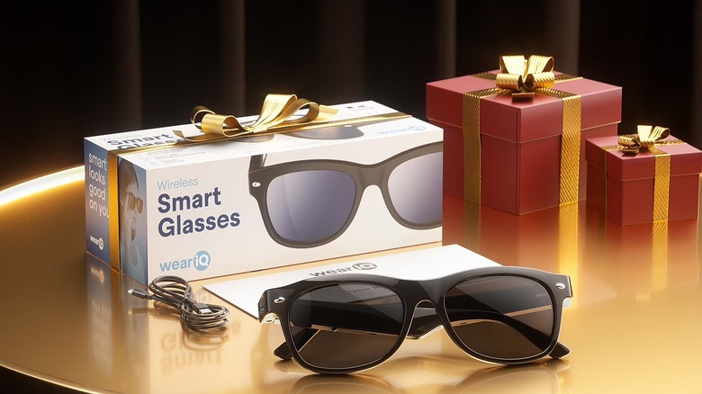 Smart glasses placed in front of its box wrapped as a gift