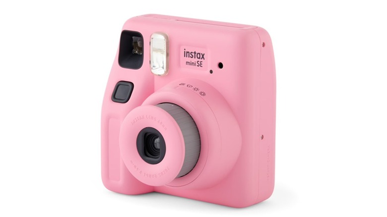 The Fujifilm Instax Mini SE instant camera in pink, on a white background.