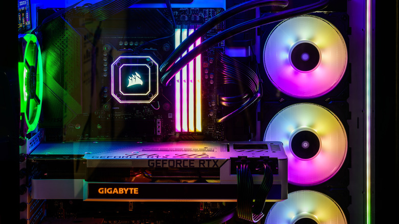 A large liquid cooler visible inside a complete PC with high levels of RGB ligthing.