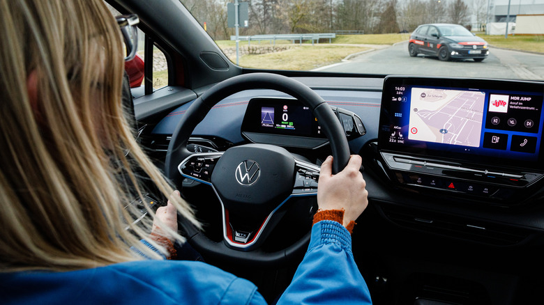 Image of a person gently driving an electric vehicle to extend it's range