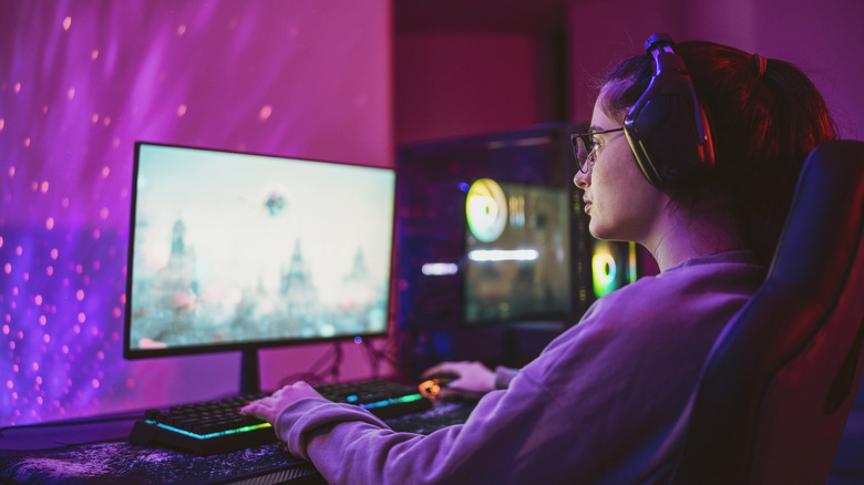 A person playing video games on a computer.