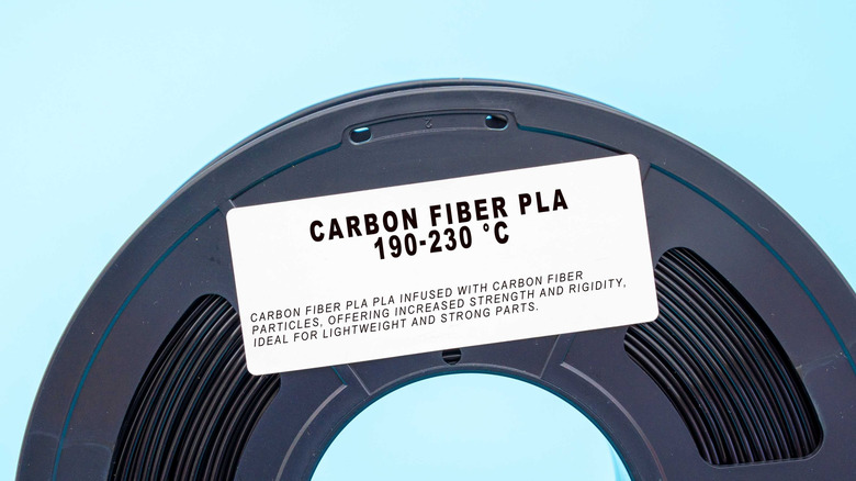 A roll of carbon fiber PLA filament with a label specifying its temperature.