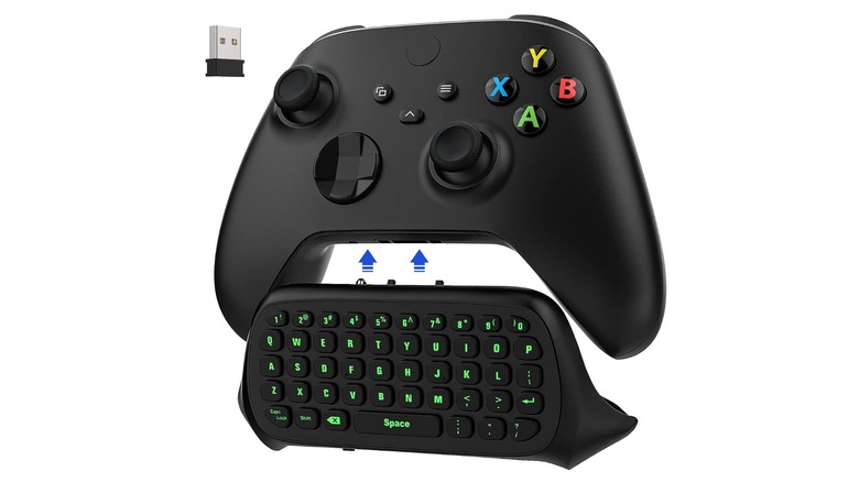 An Xbox controller equipped with a keyboard attachment isolated on a white background.