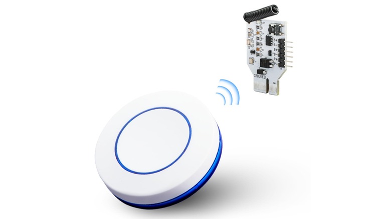 A wireless PC power button and its receiver isolated on a white background.