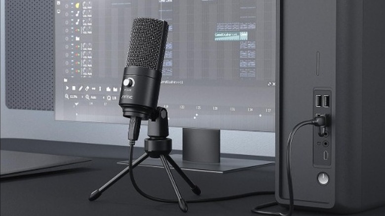 FIFINE USB Microphone in front of a PC monitor