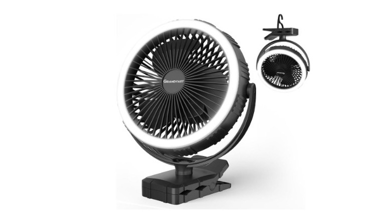 A rechargeable fan standing upright with a smaller version of the same fan hanging by its clip in the upper right