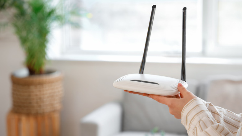 Holding a Wi-Fi router