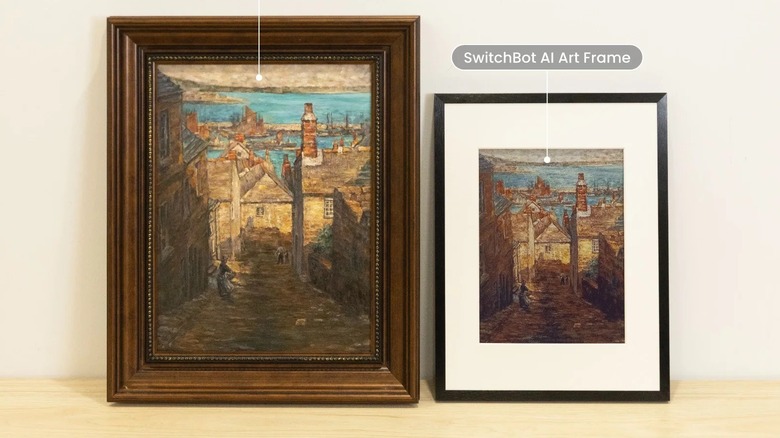 SwitchBot AI Art Frame placed next to a real art print on a shelf