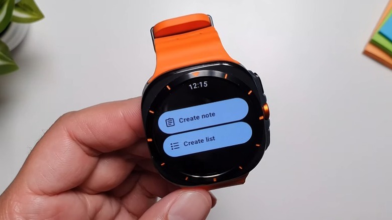 A person holding up a Galaxy Watch 2 Ultra with the Google Keep app open.