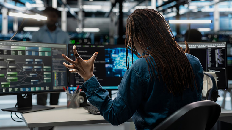 A person getting frustrated at their computer.