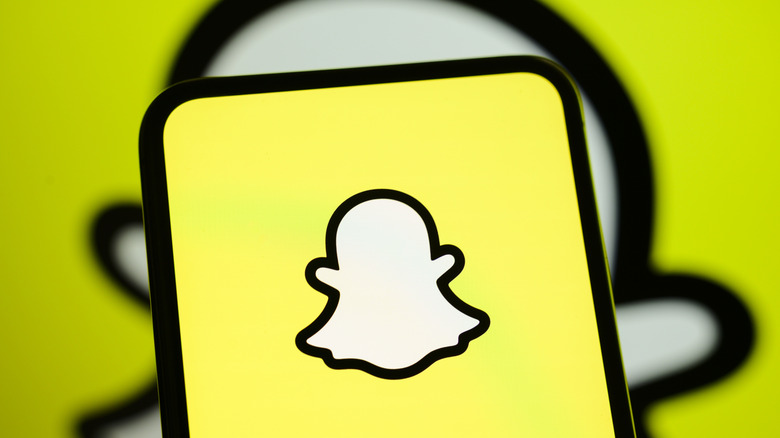 The Snapchat logo on a smartphone