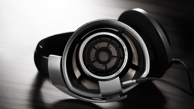 The Sennheiser HD 800 S headphones lying on a wooden table