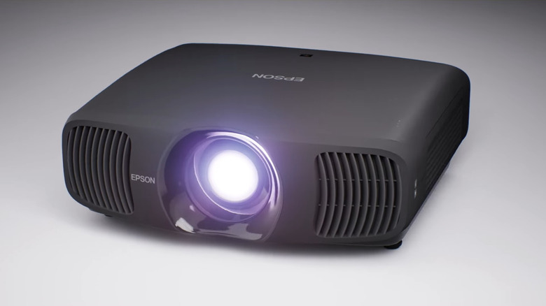 Epson LS12000 Home Theater Projector on a grey background