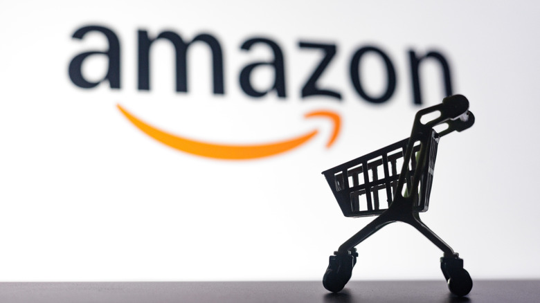 Scaled cart replica with Amazon logo in the background