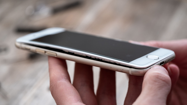 An iPhone with a swollen battery