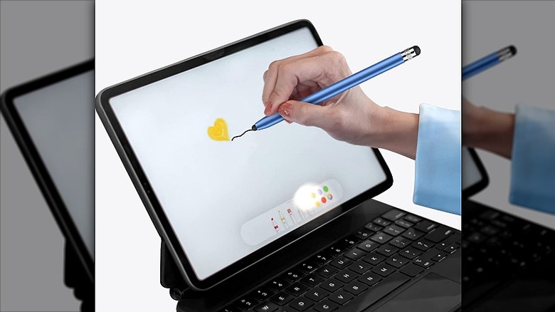 Drawing using a stylus on a tablet.