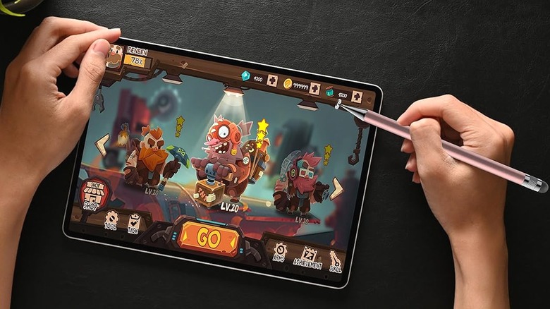 Playing game using a stylus pen on a tablet.