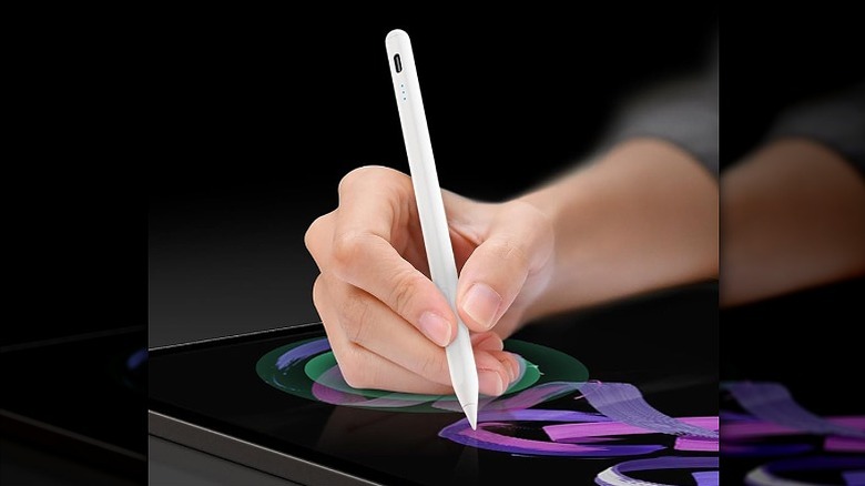 Drawing on a tablet using a stylus pen.