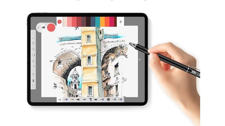 Drawing on a tablet using a stylus.