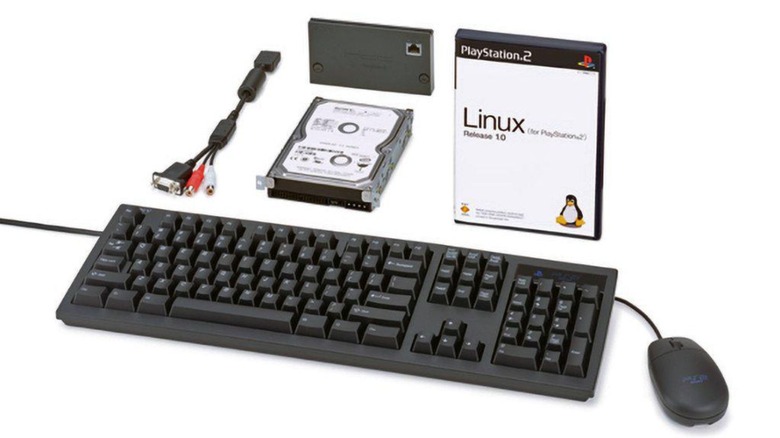The Linux for PlayStation 2 kit next to a PS2 and a keyboard