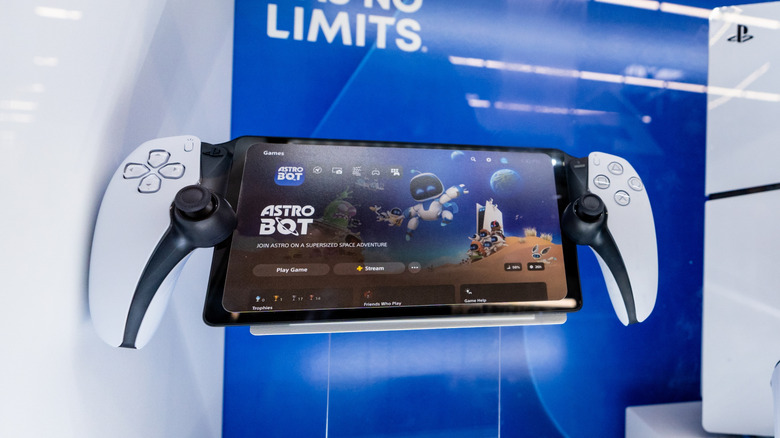 A showcase of the PlayStation Portal next to the PS5 and the DualSense controller