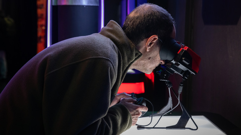A person playing on the Virtual Boy