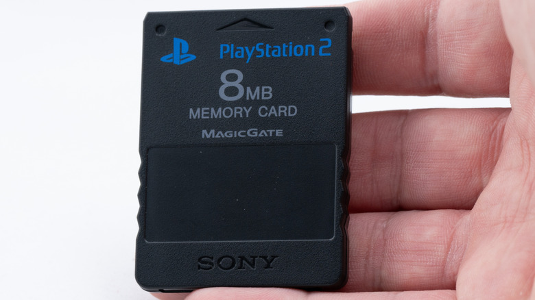 A person holding a PS2 memory card