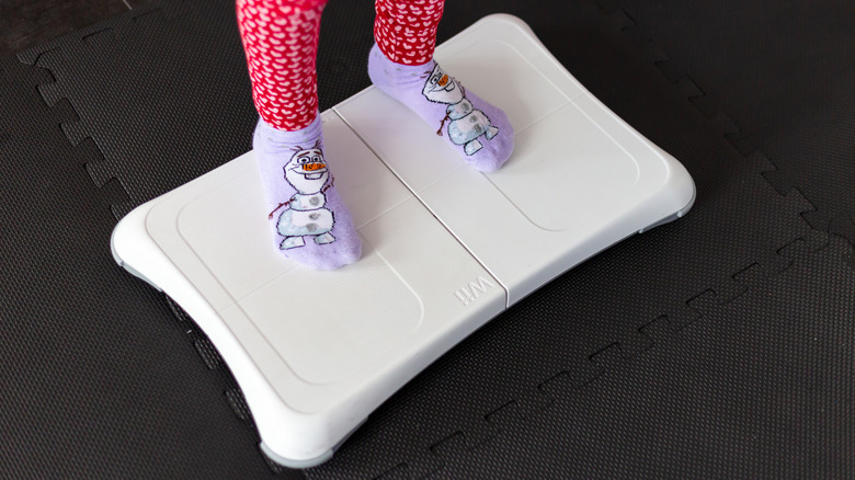 A person standing on the Wii Balance Board