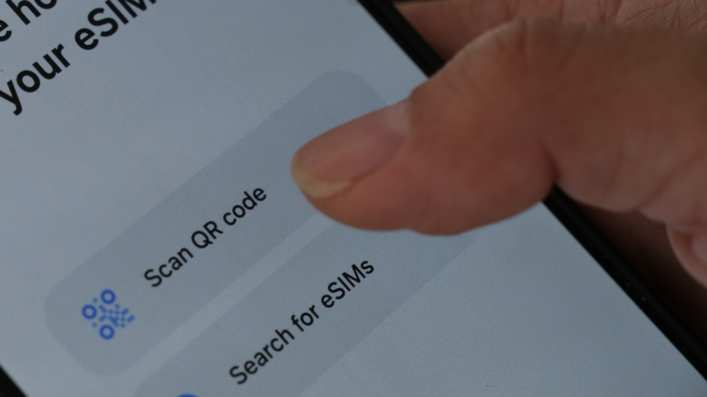 A close-up shot of someone adding an eSIM on an Android phone