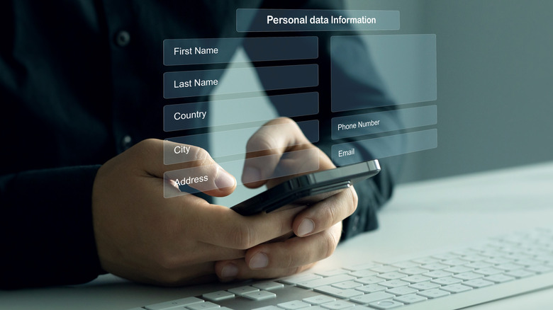 A person filling out their personal data on their phone