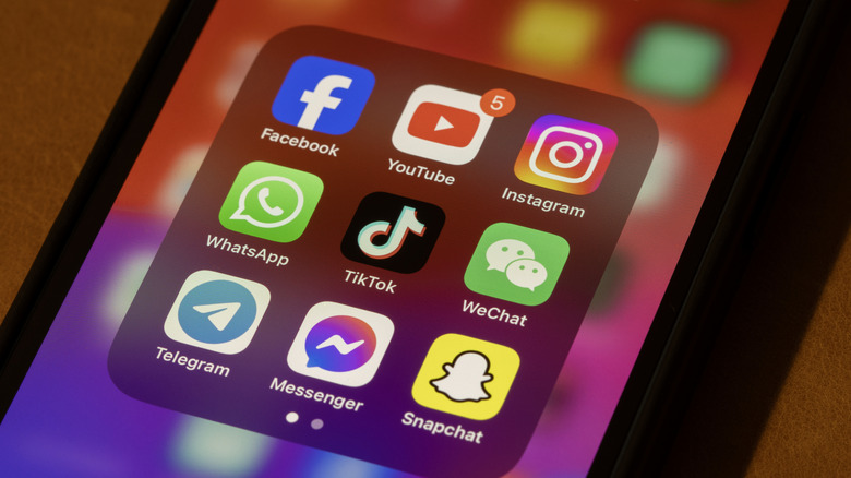 An array of social media app icons on a phone screen
