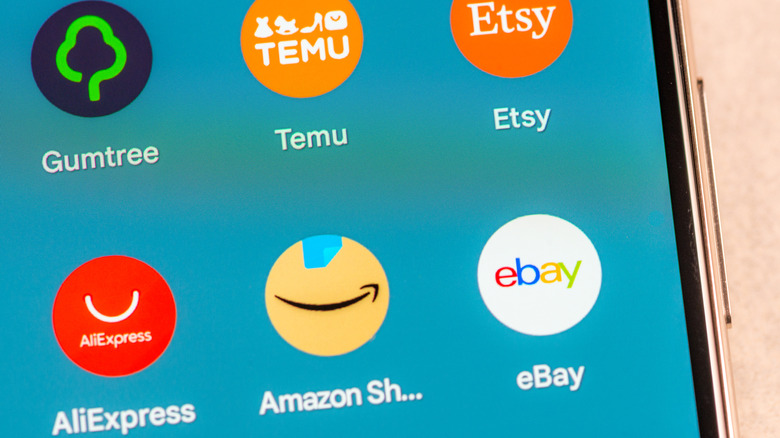 Several e-commerce app icons on a phone screen