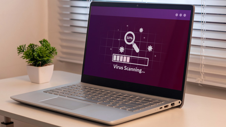 An antivirus software scanning for viruses on a laptop