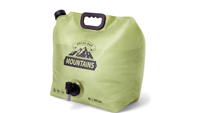 A filled up green coremuse collapsible water bag