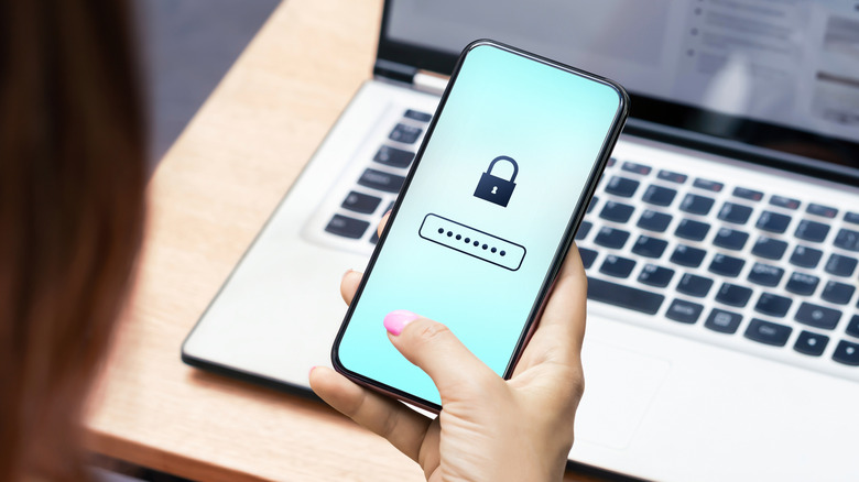 person-enterng-pin-code-on-phone