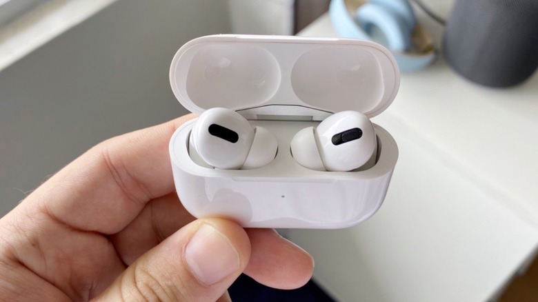 Apple's AirPods Pro earbuds on their wireless charging case
