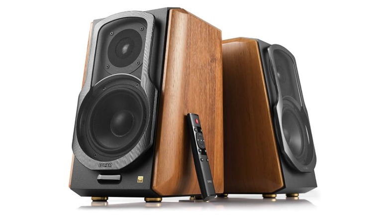 Edifier speakers with wooden brown sides and a remote