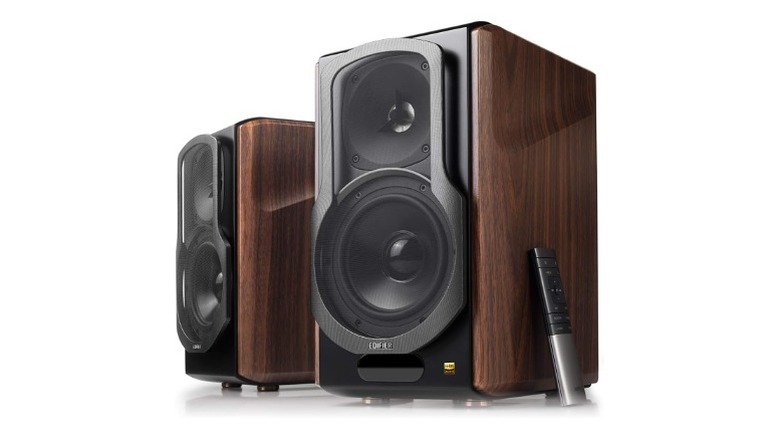 Two Speakers with one woofer and tweeter and a remote on side