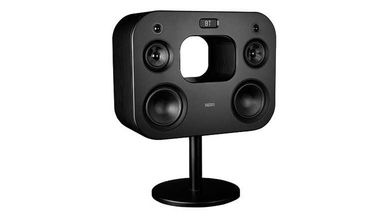Black speaker with a stand and oval grip with an empty space in the middle