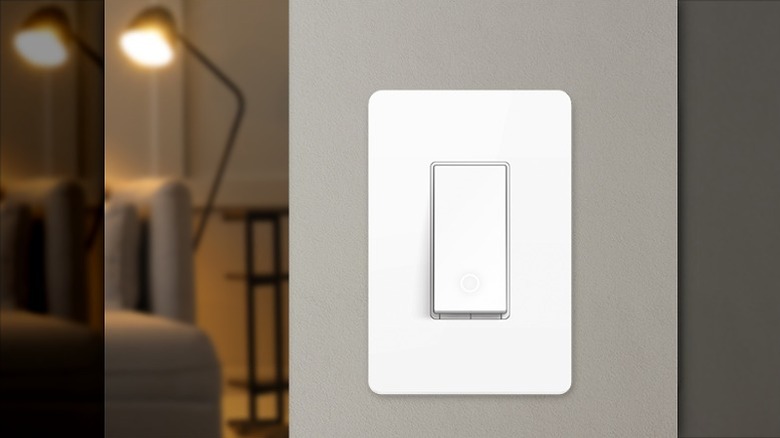 White smart switch installed on a wall