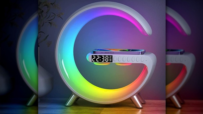 G-shaped table lamp lit in RGB colors