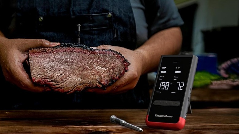 Smart thermometer showing meat temperature