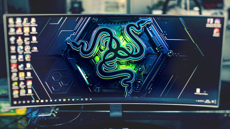 An ultrawide monitor with a Razer wallpaper