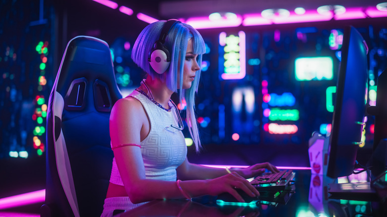 A streamer gaming on an ultrawide screen